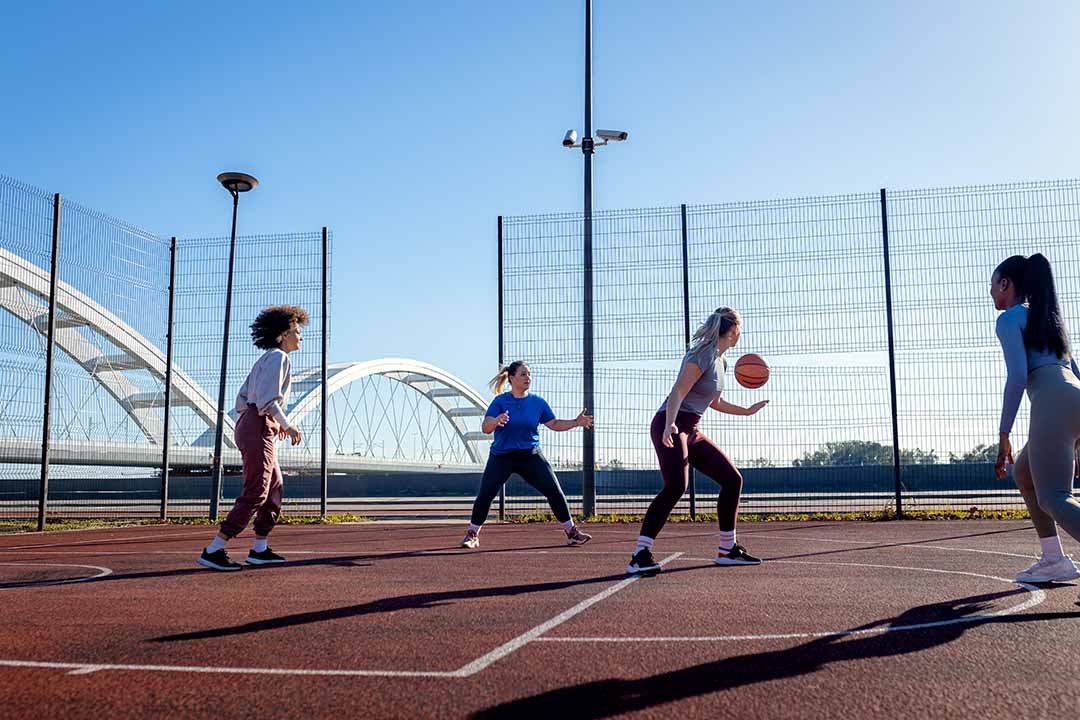 Diverse group of young woman having fun playing recreational bas